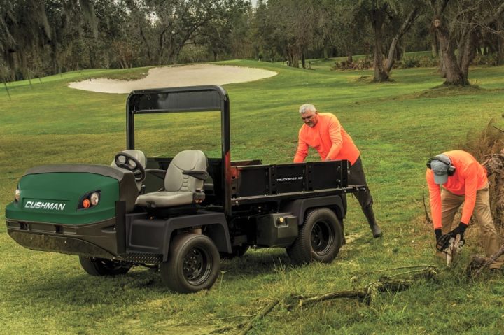 Cushman Truckster XD loading a tree from a golf course