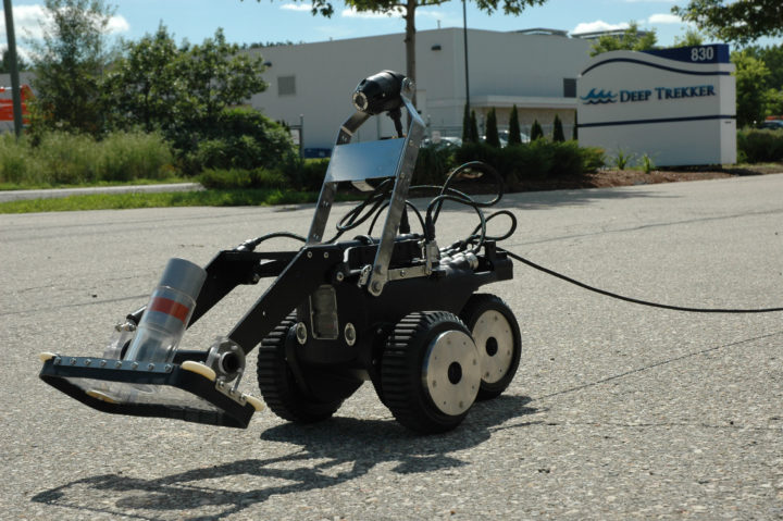 DT640 VAC being driven in a parking lot with a Deep Trekker warehouse in the background