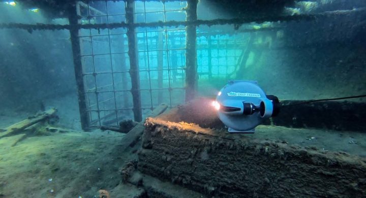 DTG3 checking out an old shipwreck underwater.