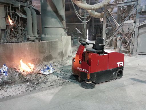 Factory Cat TR sweeping a foundry floor