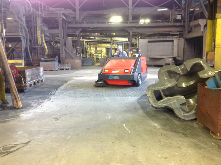 PowerBoss 10X Sweeper cleaning a manufacturing facility
