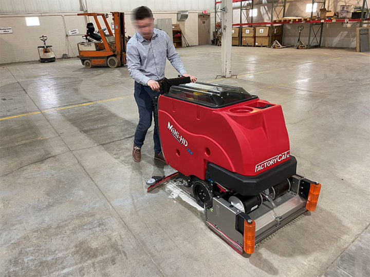 Factory Cat Mini-HD Floor Scrubber cleaning a warehouse