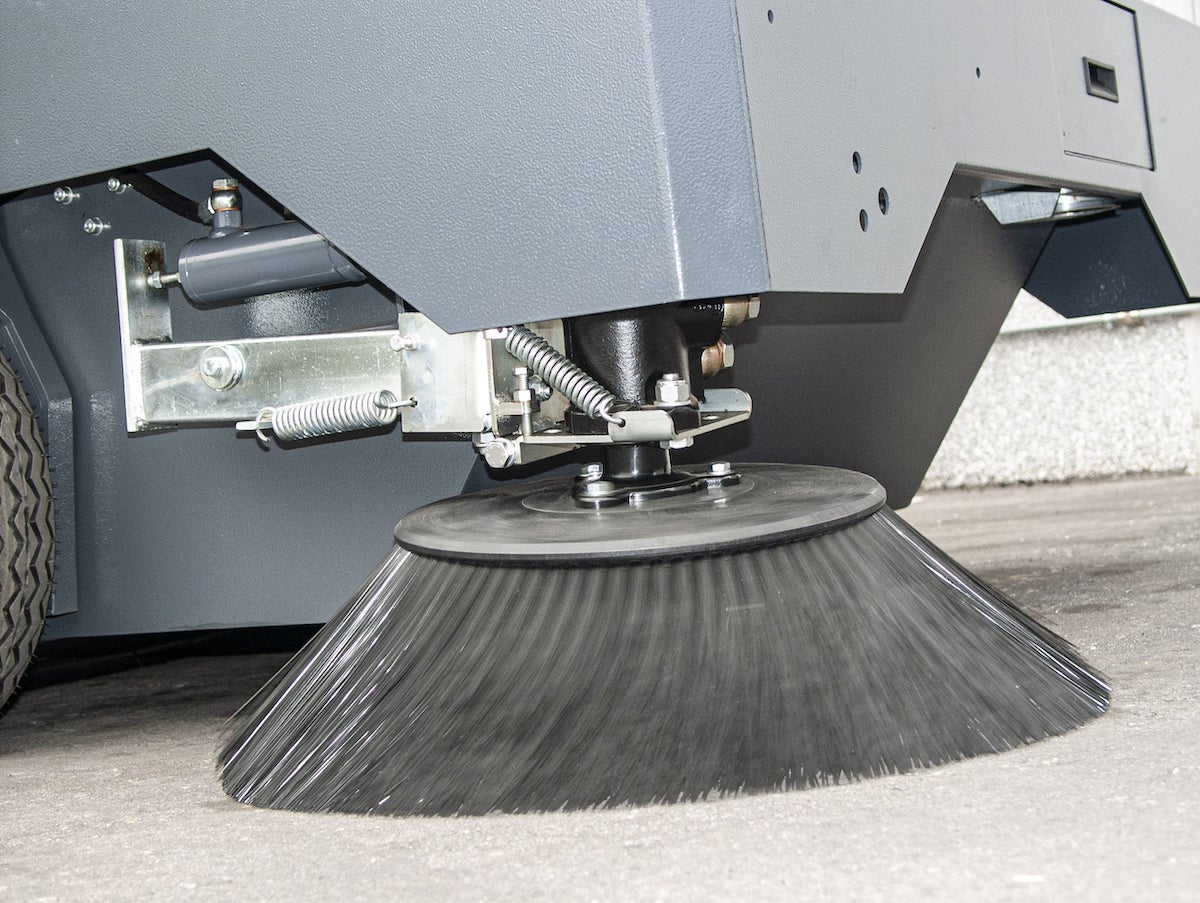 The front side brush of a Dulevo 120 Sweeper in motion.