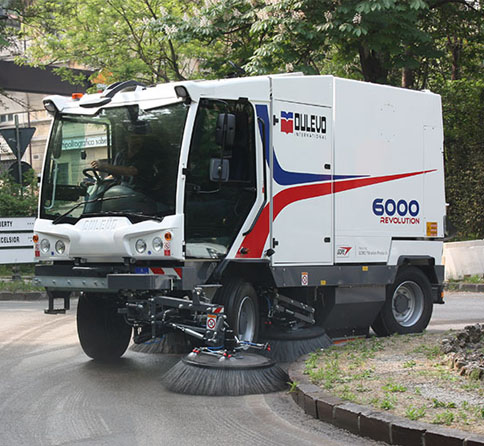 Dulevo 6000 street sweeper cleaning around the curve of a roundabout