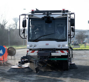 Dulevo D6 Street Sweeper sweeping near construction signs in a parking lot